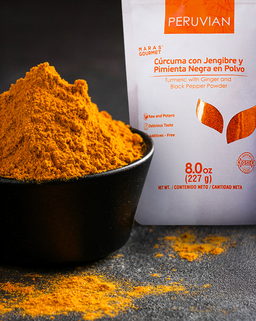Organic Turmeric powder in black bowl - natural anti-inflammatory superfood from Peru UK